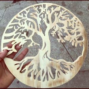 A wooden ornament that depicts a tree